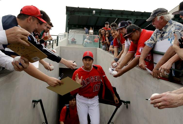 Fans plead for an autograph from Shohei Ohtani
