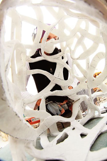 Turk works on a sculpture in her studio.
