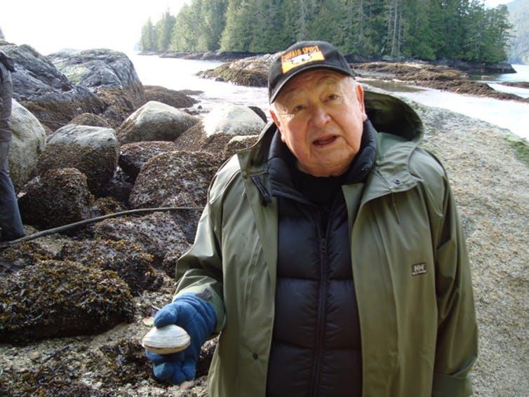 Kwaxsistalla Chief Adam Dick with a butter clam