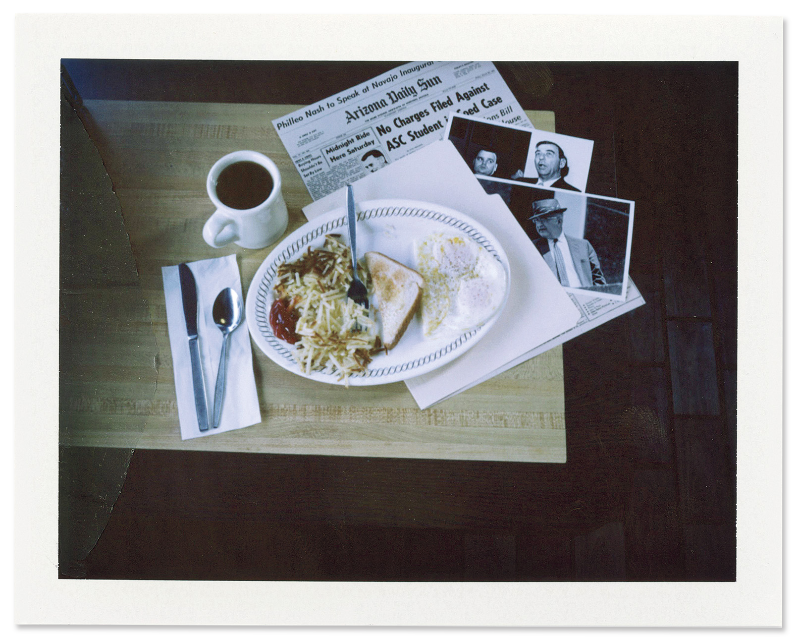 Old news stories and photographs of Billy James Hargis and Edwin Walker are laid out on a table at a Waffle House in Pelham, Alabama.