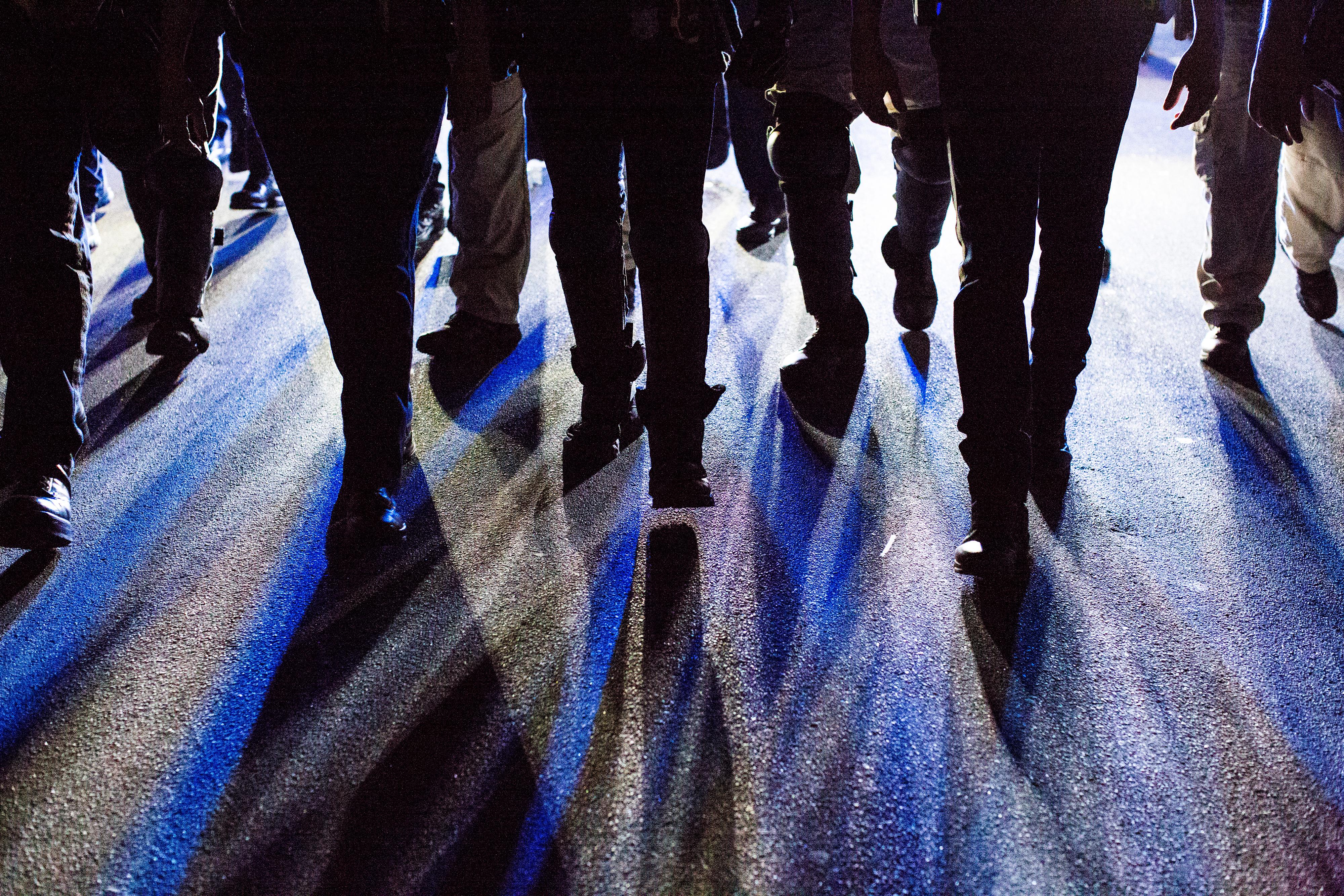Police walk in formation